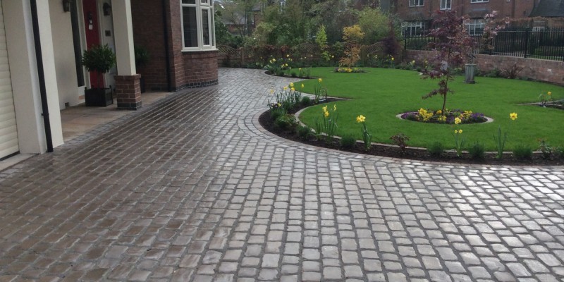 New lawn and design and Drivesys original cobble front driveway
