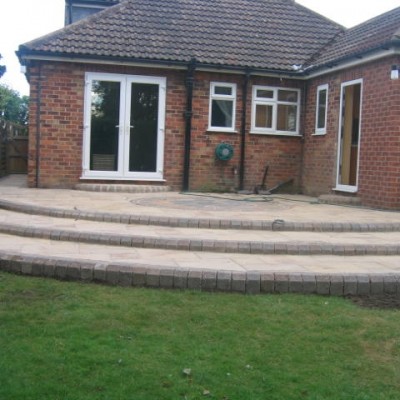 Curved Steps Sweeping up to Indian Stone Patio