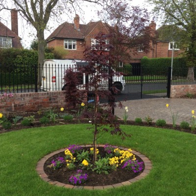 New lawn and design and Drivesys original cobble front driveway