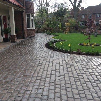 New lawn and design and Drivesys original cobble front driveway
