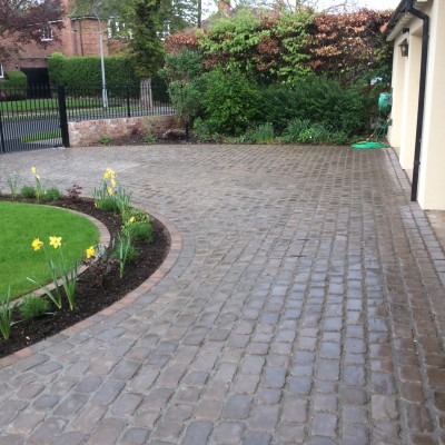 New lawn and design and Drivesys original cobble front driveway