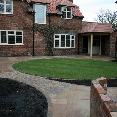 New lawn and design with Indian Stone paving