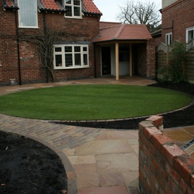 New lawn and design with Indian Stone paving