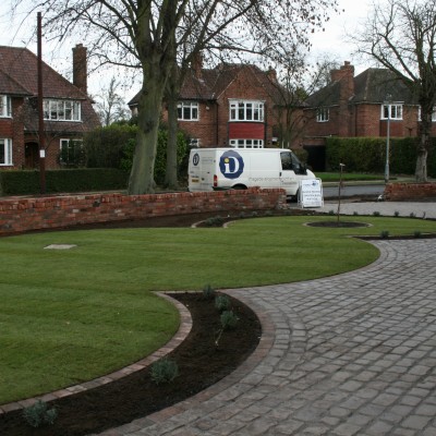 New lawn and design and Drivesys original cobble front driveway