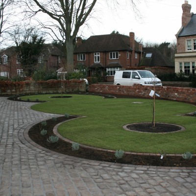 New lawn and design and Drivesys original cobble front driveway