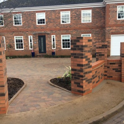 Tegula block paving (pennant grey) and brick walling