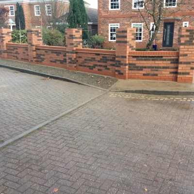 Tegula block paving (pennant grey) and brick walling