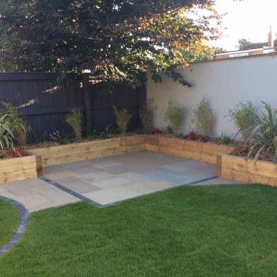 80. Sherburn-in-Elmet (after) Indian Stone with Charcoal Blocks, Wooden Raised Sleeper Planters and Planting 