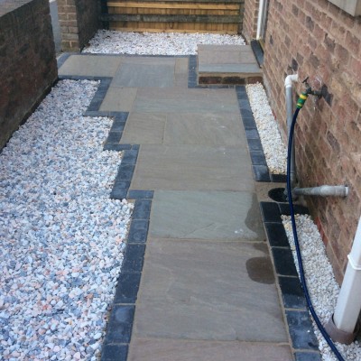 81. Sherburn-in-Elmet (after) Indian Stone with Charcoal Blocks, Wooden Raised Sleeper Planters and Planting 