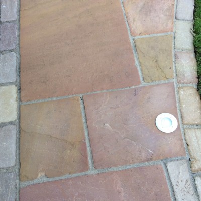 New lawn and design with Indian Stone paving and built in lights