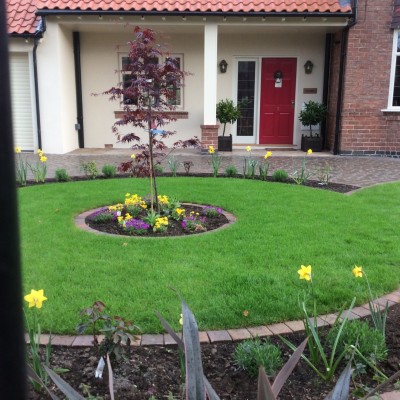 New lawn and design and Drivesys original cobble front driveway